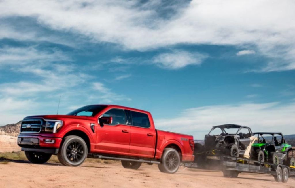 Ford F-150 Lariat Vermelha em um ambiente com areia