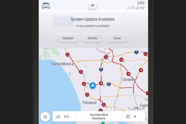 L'écran affiche le planificateur d'itinéraire et une fenêtre contextuelle de mise à jour.