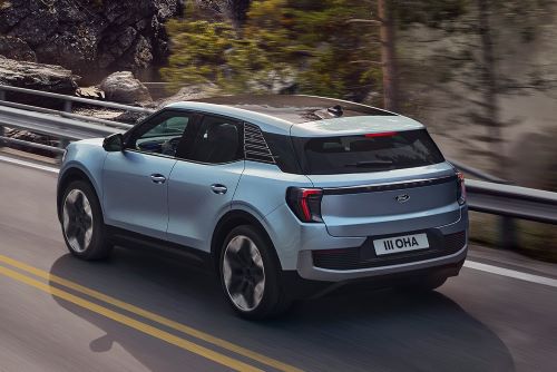 Ford Explorer driving near forest