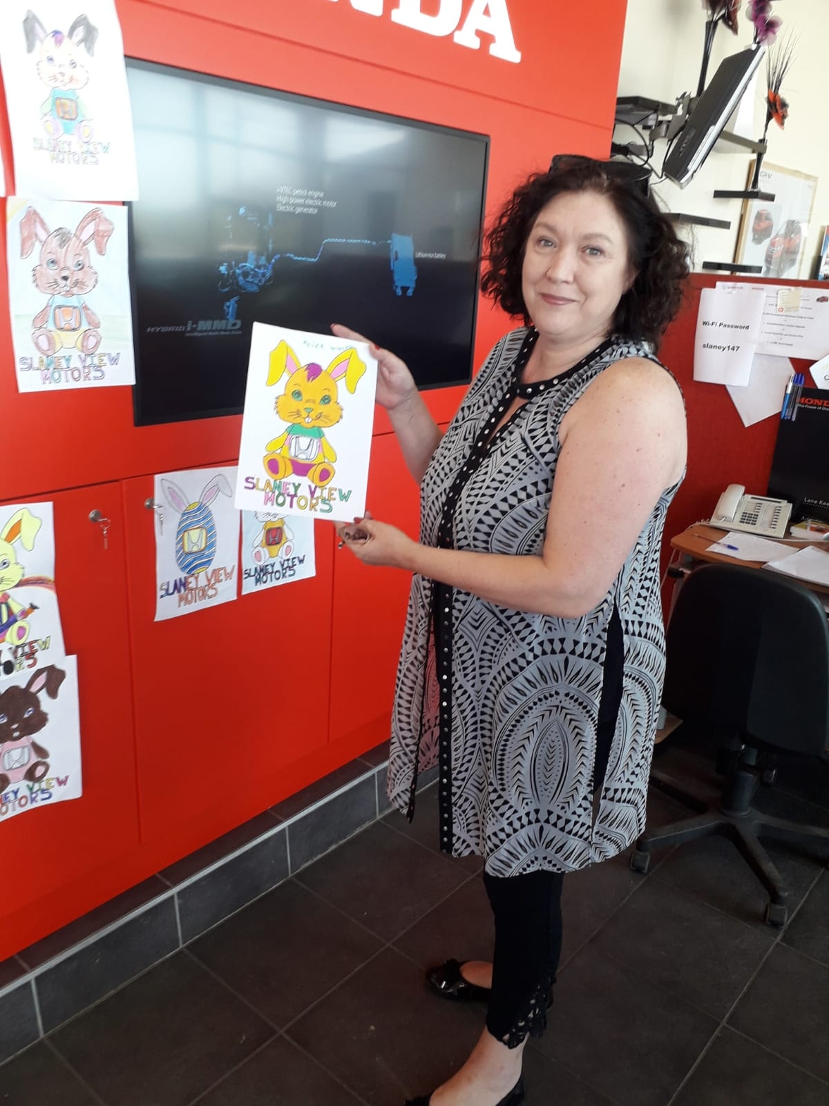 Mai Fanning picking the winner of our Easter Colouring Competition