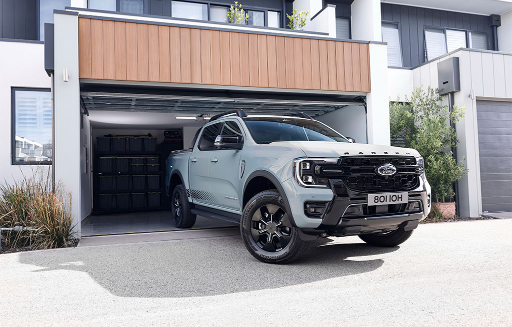 Ford Ranger Plug-in Hybrid Stormtrak Launch Edition parked outside modern home garage