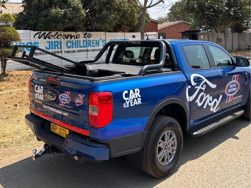 Truck in front of childrens centre ford truck in front of childrens centre